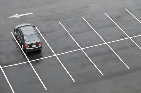 Single car in parking lot
